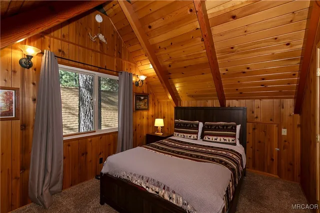 a view of a house with a chairs in a patio