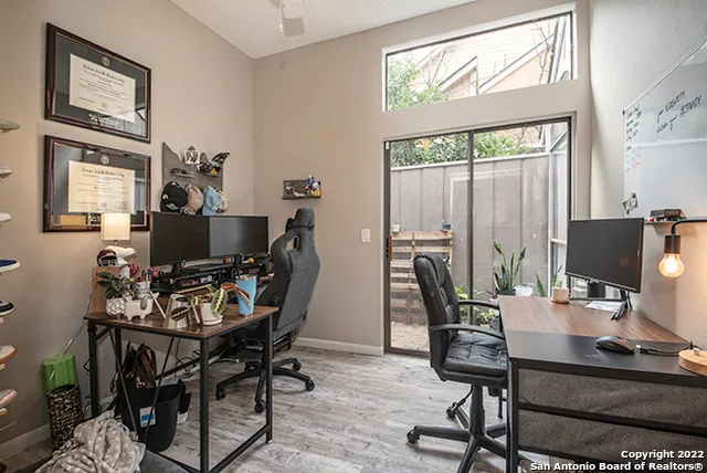 a workspace with furniture and a window