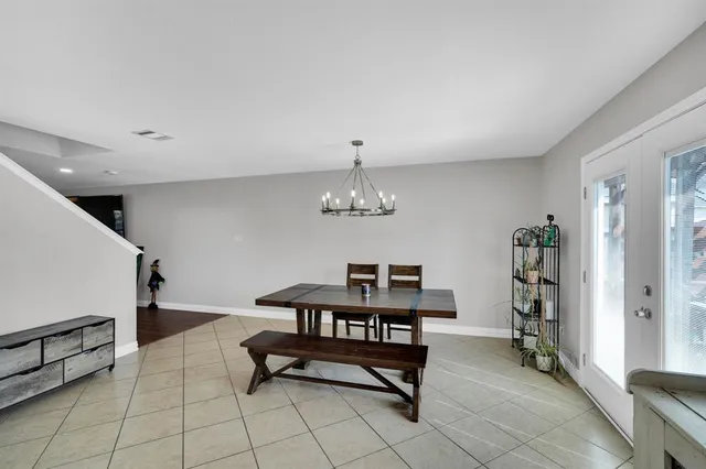 a kitchen with stainless steel appliances granite countertop a refrigerator and a stove