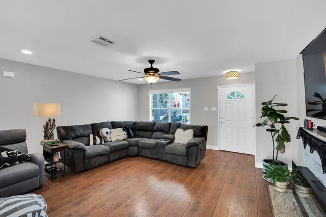 a bathroom with a granite countertop bathtub sink and mirror