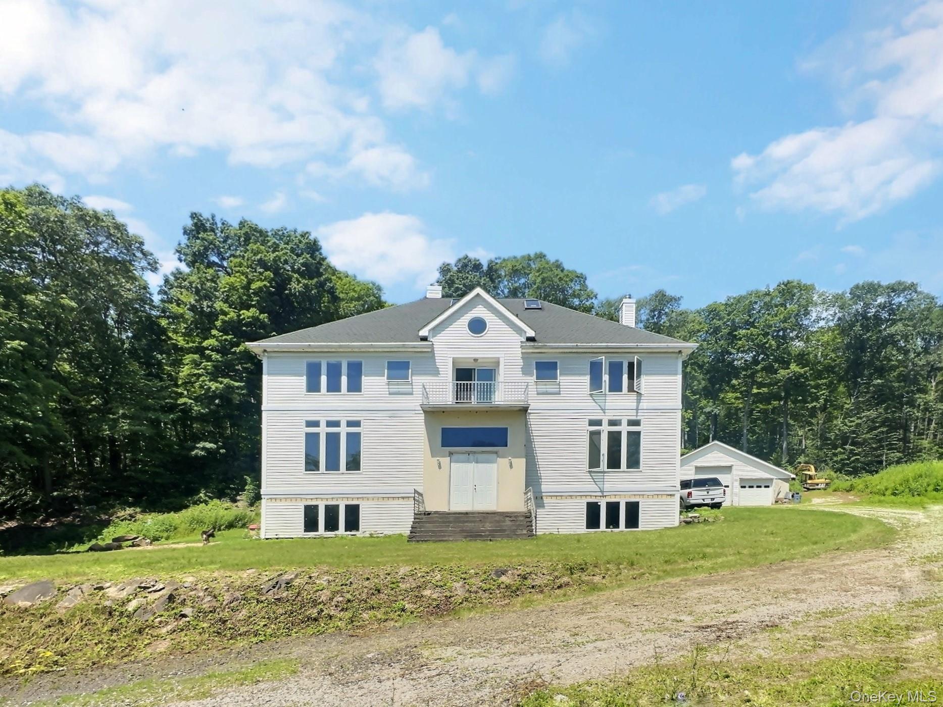118 Scenic Ridge Drive Brewster, NY 10509 - Photo 2 of 50 a front view of a house with a yard