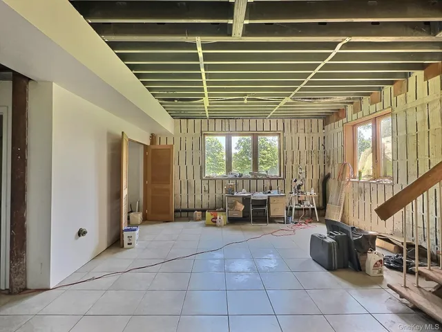 a lobby with furniture and floor to ceiling window