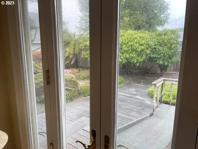 a view of a glass door and outside view