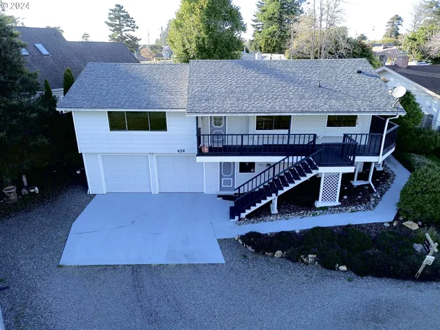 a view of a house with pool and wooden floor