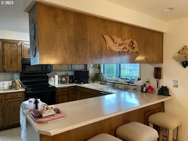 a kitchen with a table and chairs in it