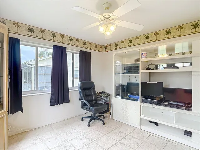 a view of a kitchen with refrigerator and cabinet