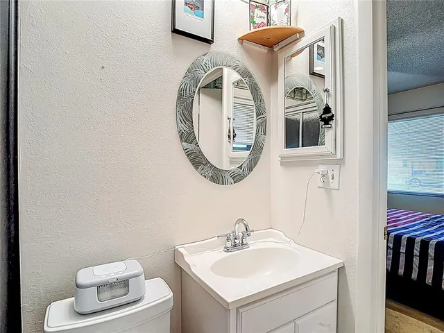 a view of walk in closet with clothes