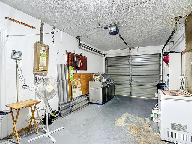 a view of a house with backyard and garden