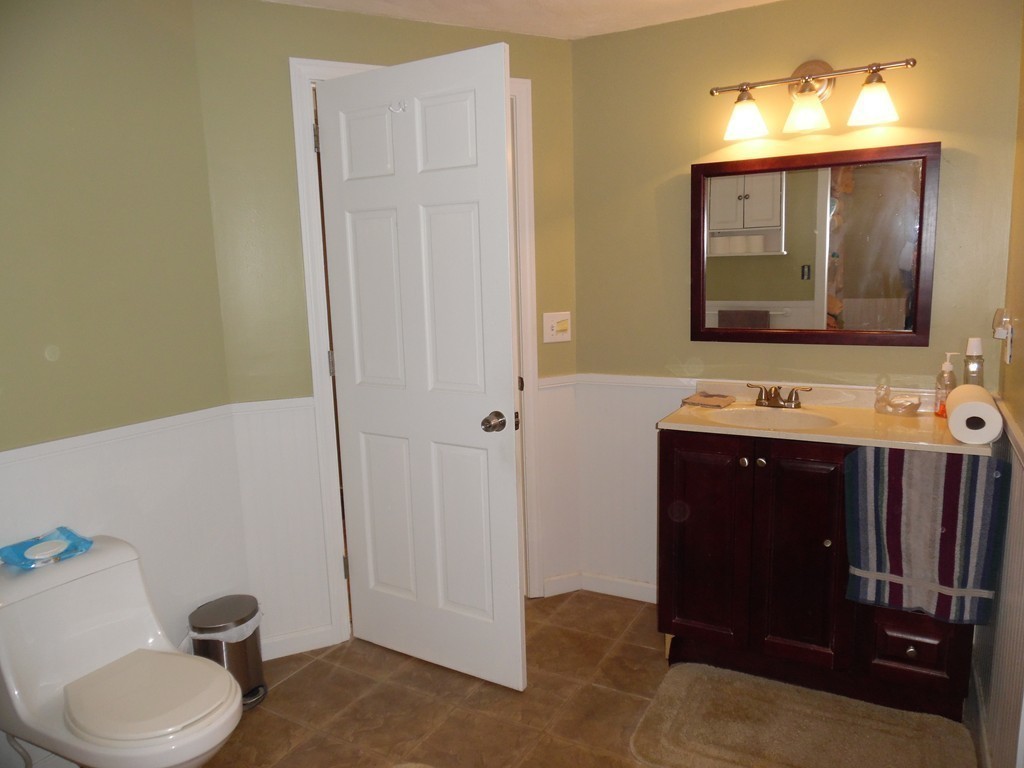 61 Helberg Road Springfield, MA 01128 - Photo 13 of 30 a bathroom with a toilet sink and mirror