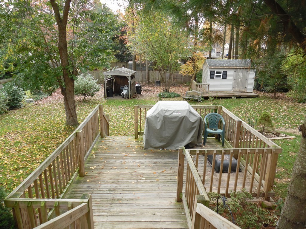 61 Helberg Road Springfield, MA 01128 - Photo 24 of 30 a view of a deck with two chairs and wooden fence