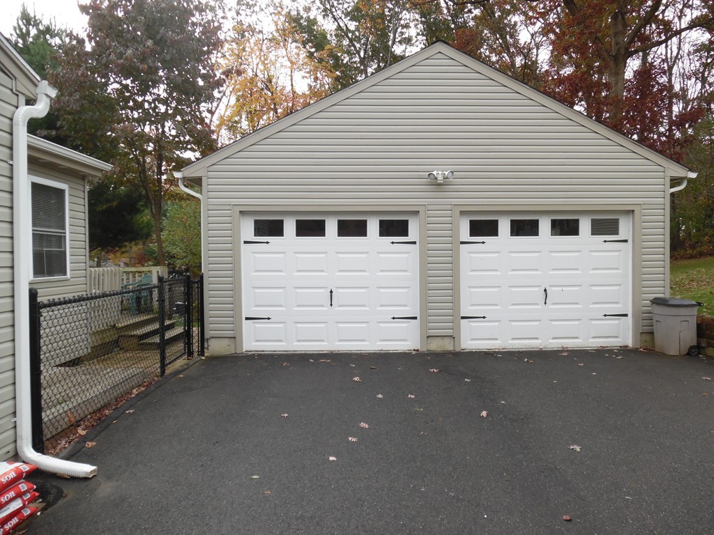61 Helberg Road Springfield, MA 01128 - Photo 3 of 30 a view of a house with a garage