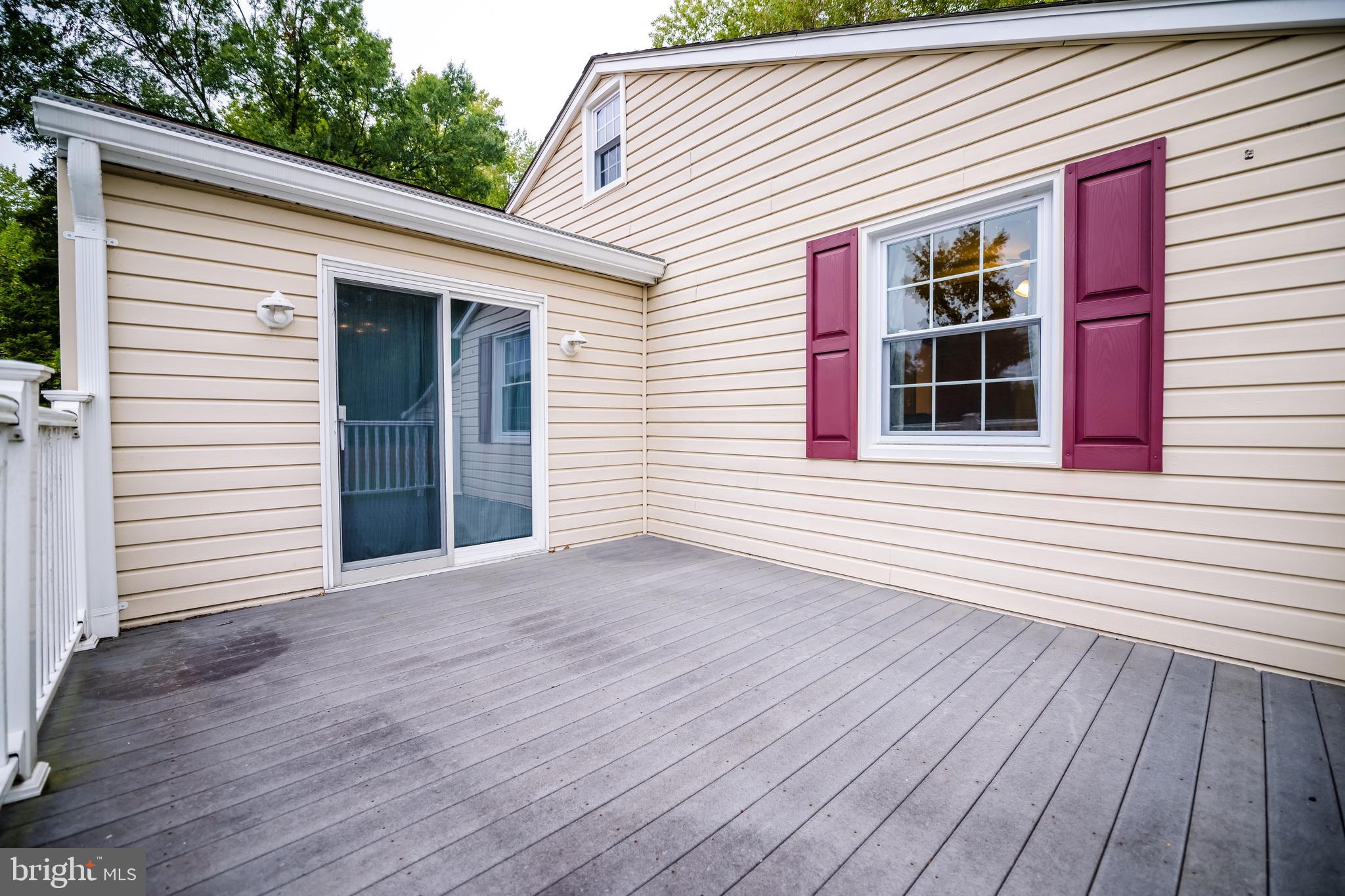 1107 Maple Road Essex, MD 21221 - Photo 41 of 42 a view of a house with wooden deck