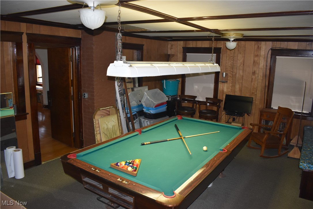 4581 Pearl Road Cleveland, OH 44109 - Photo 10 of 36 Recreation room featuring wood walls, pool table, and dark colored carpet