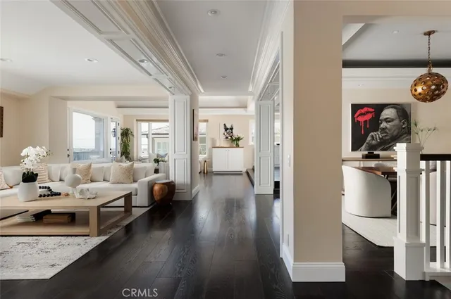 a living room with couches and a flat screen tv