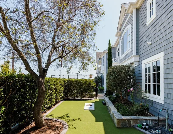 a aerial view of a house with swimming pool and sitting area