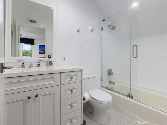 a view of a house with pool table and chairs