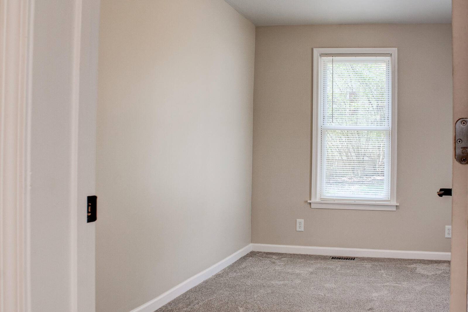 3765 Rutrough Road Southeast Roanoke, VA 24014 - Photo 8 of 25 an empty room with a window