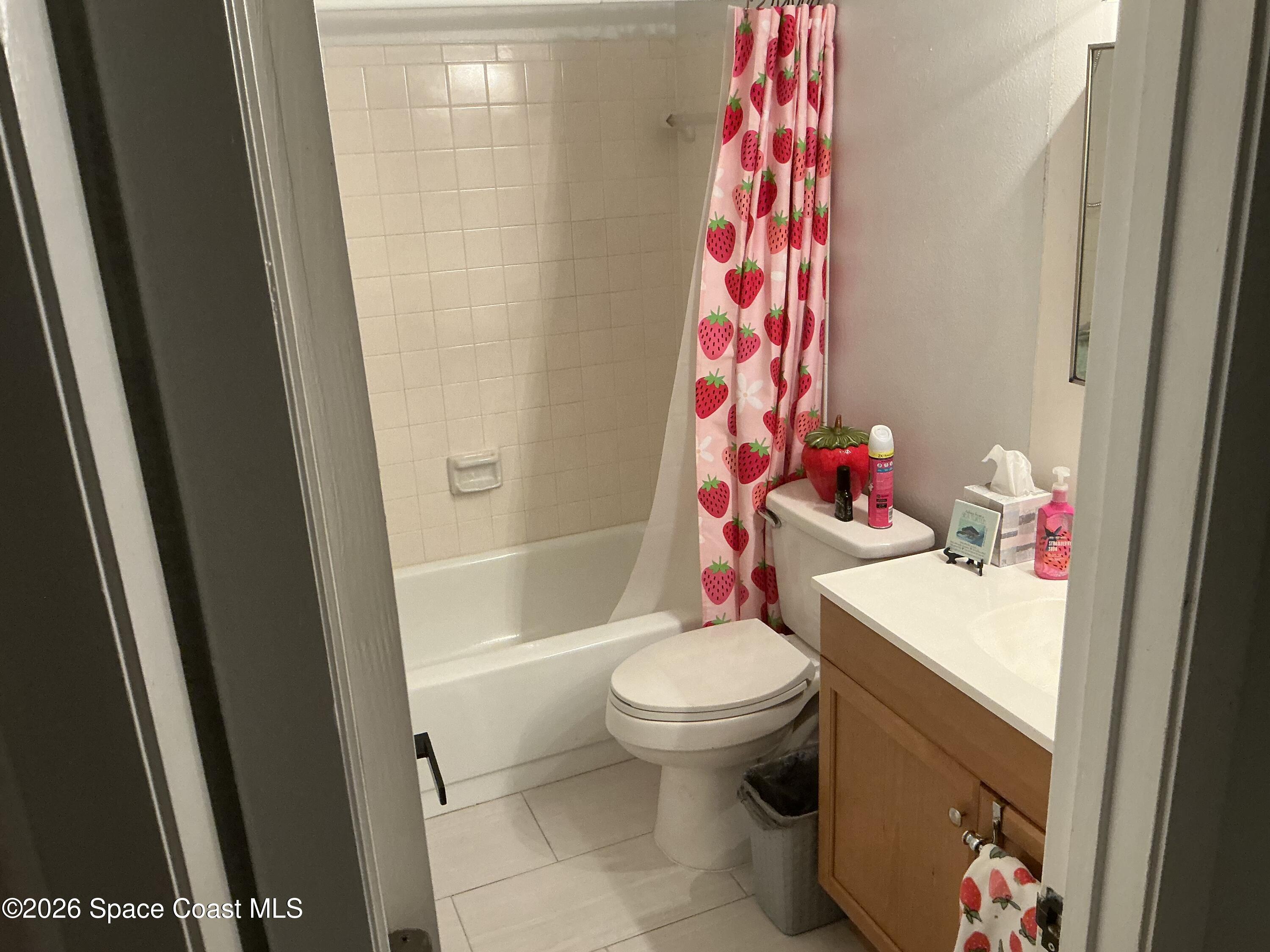 1470 Sheafe Avenue Northeast, Unit 106 Palm Bay, FL 32905 - Photo 11 of 16 a bathroom with a sink toilet and shower