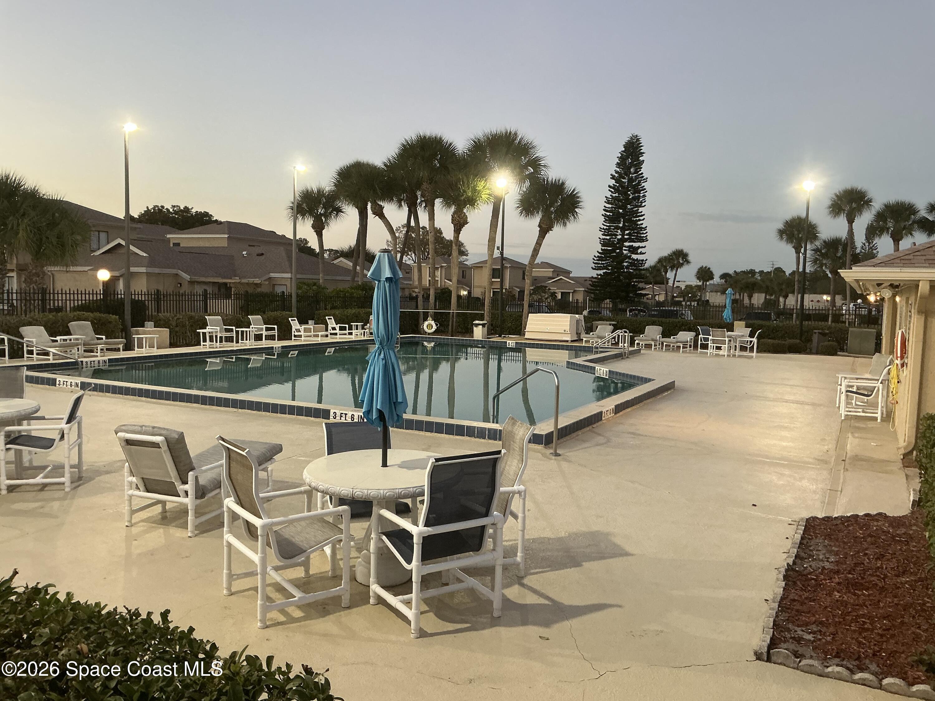 1470 Sheafe Avenue Northeast, Unit 106 Palm Bay, FL 32905 - Photo 13 of 14 a view of a swimming pool