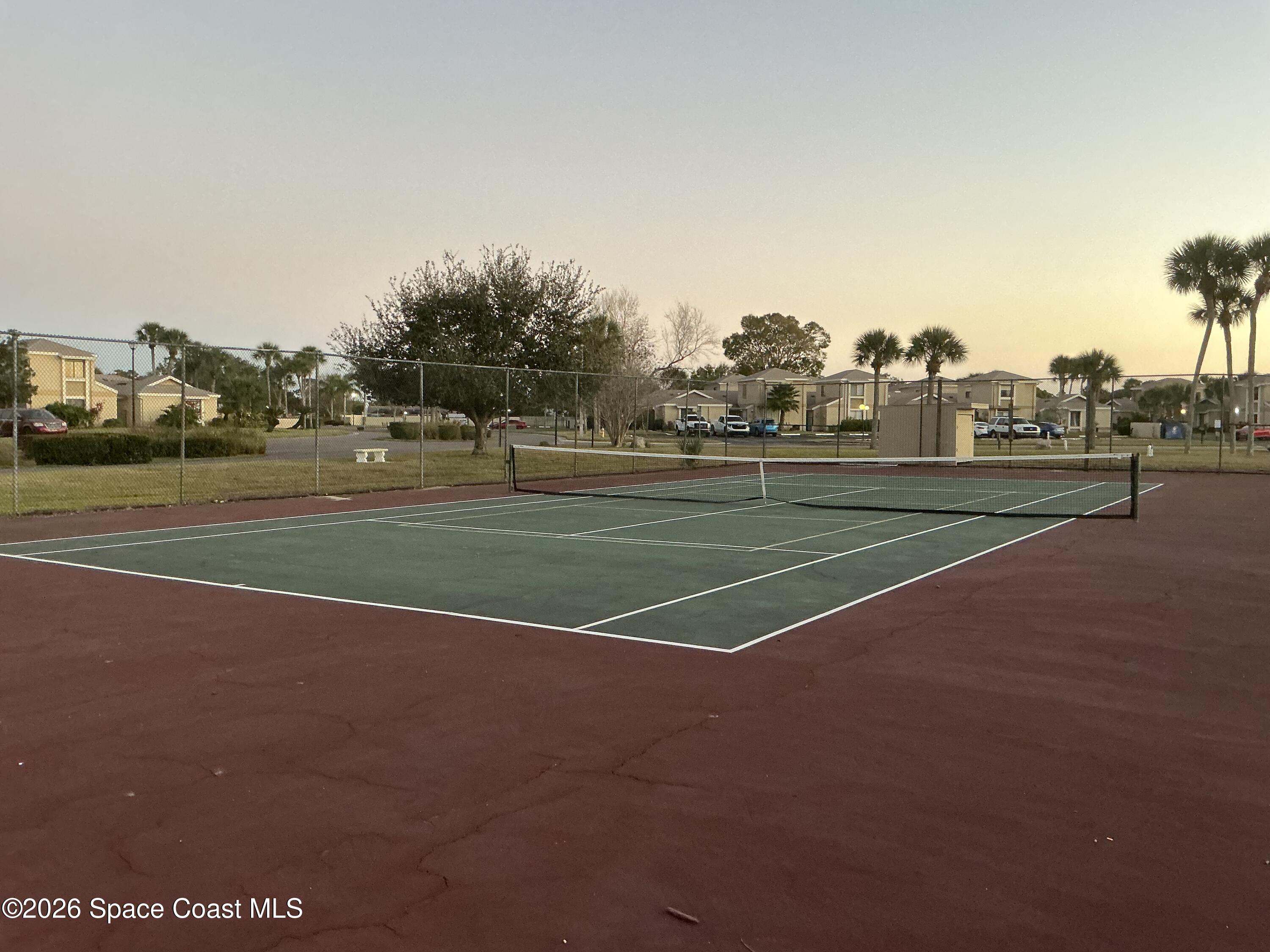 1470 Sheafe Avenue Northeast, Unit 106 Palm Bay, FL 32905 - Photo 14 of 14 a view of a tennis court