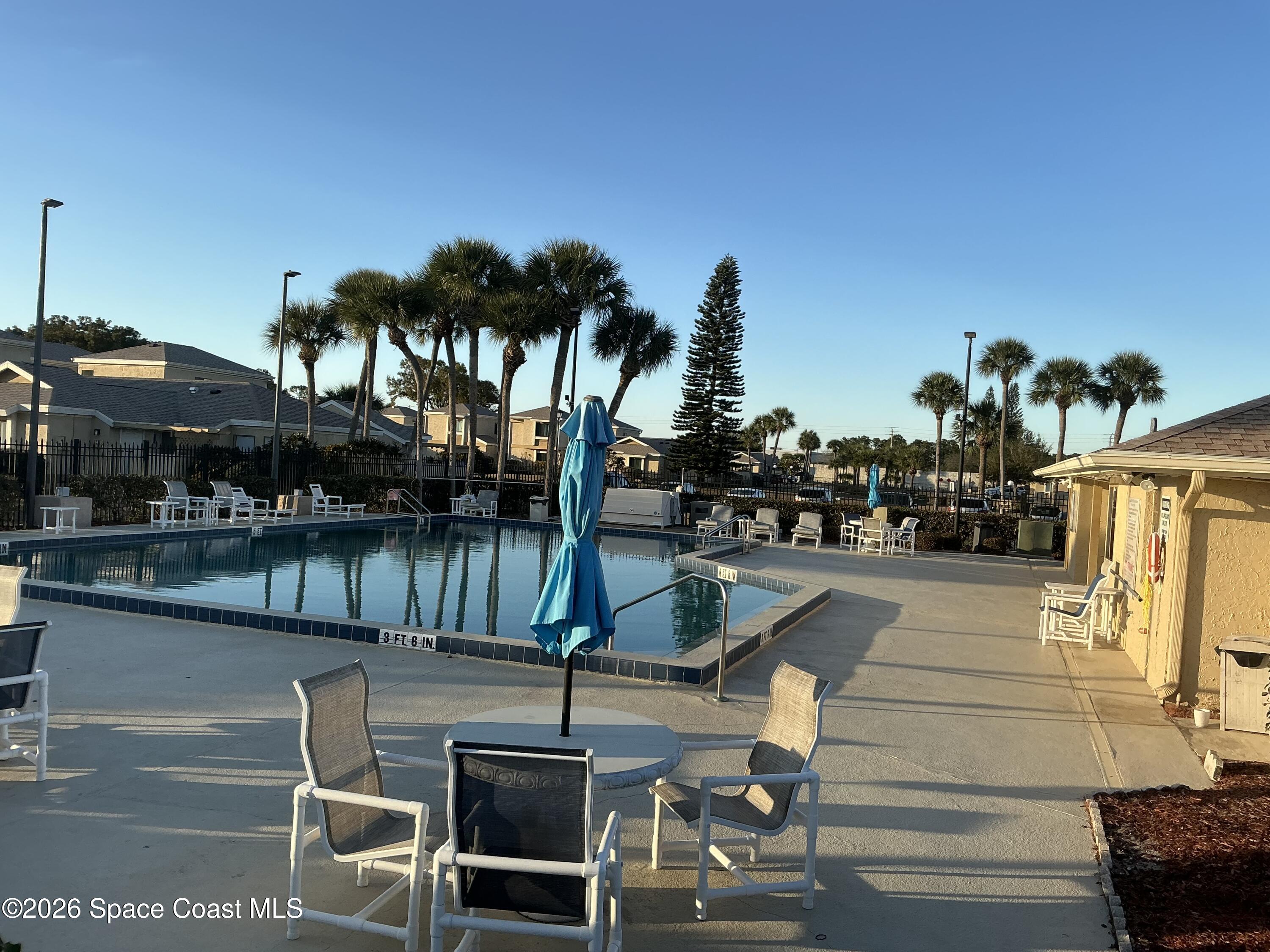 1470 Sheafe Avenue Northeast, Unit 106 Palm Bay, FL 32905 - Photo 14 of 16 a view of fountain along with lake view