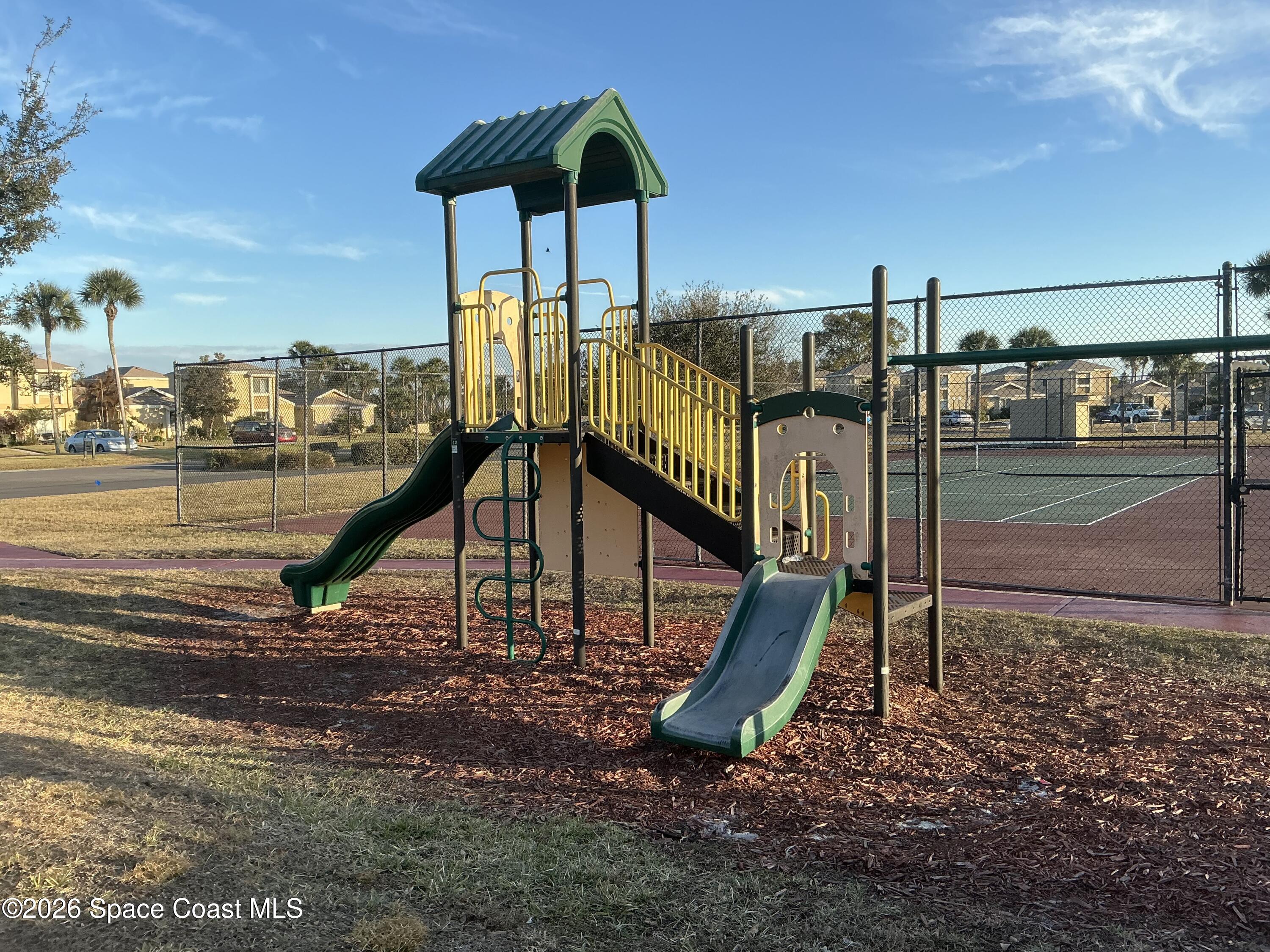1470 Sheafe Avenue Northeast, Unit 106 Palm Bay, FL 32905 - Photo 15 of 16 a view of a park with a slide