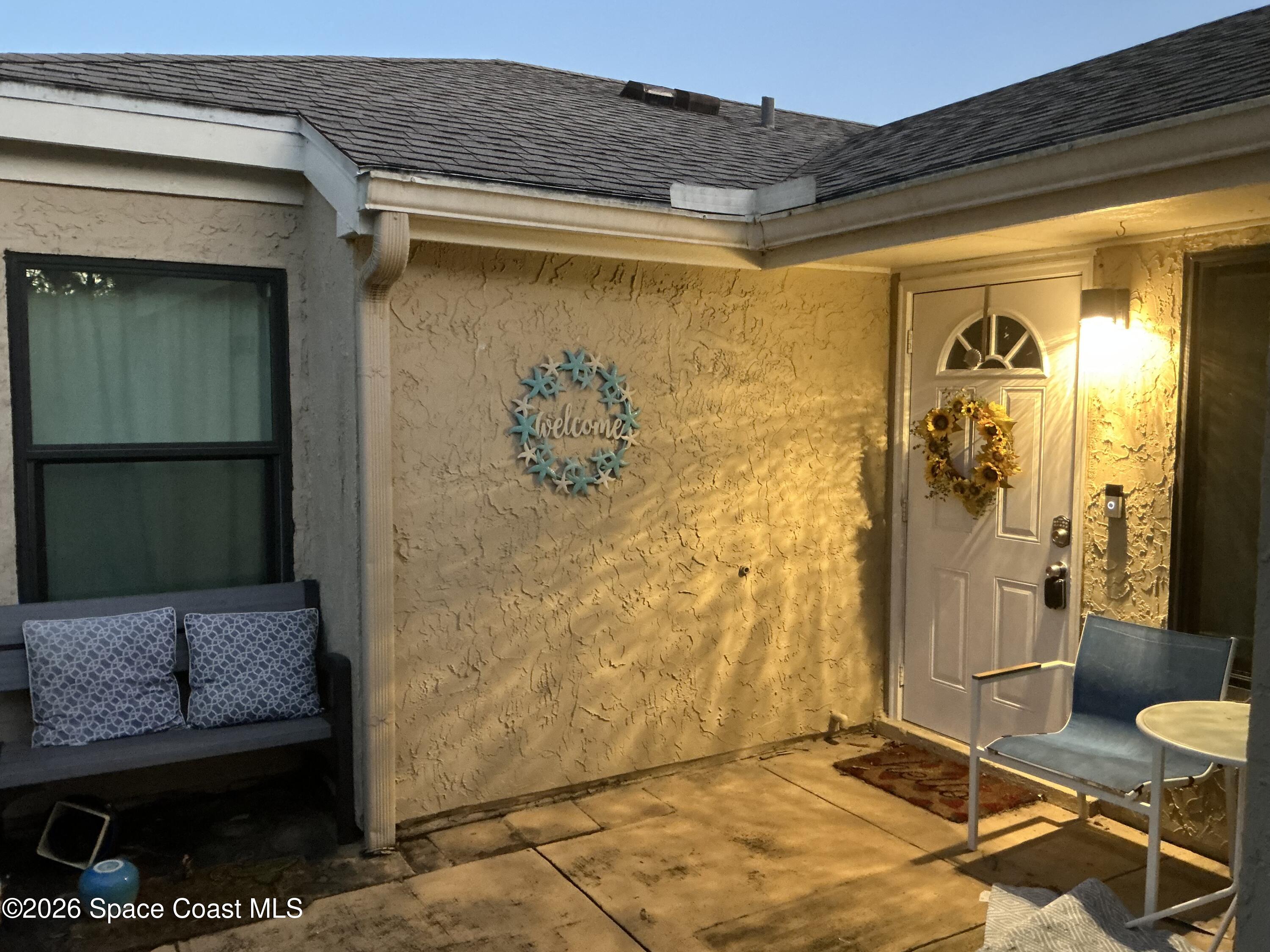 1470 Sheafe Avenue Northeast, Unit 106 Palm Bay, FL 32905 - Photo 3 of 14 a bathroom with a granite countertop shower and a mirror