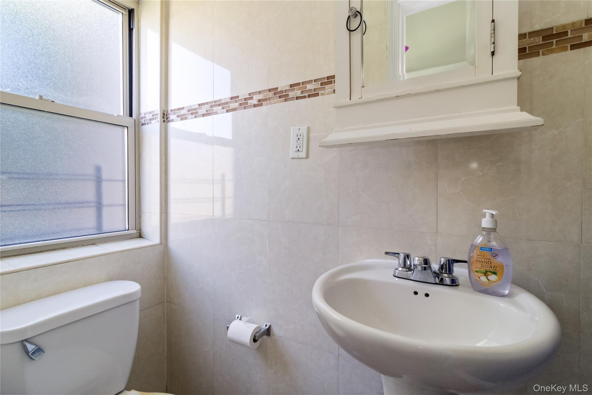 10223 43rd Avenue, Unit 2B Queens, NY 11368 - Photo 12 of 15 a bathroom with a sink and a toilet