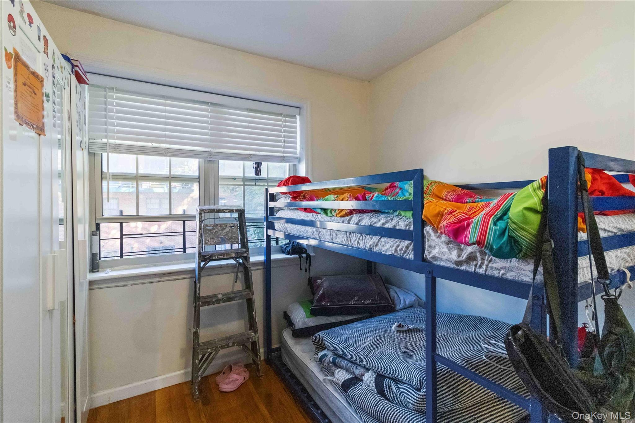 10223 43rd Avenue, Unit 2B Queens, NY 11368 - Photo 13 of 15 a utility room with stainless steel appliances furniture and a window