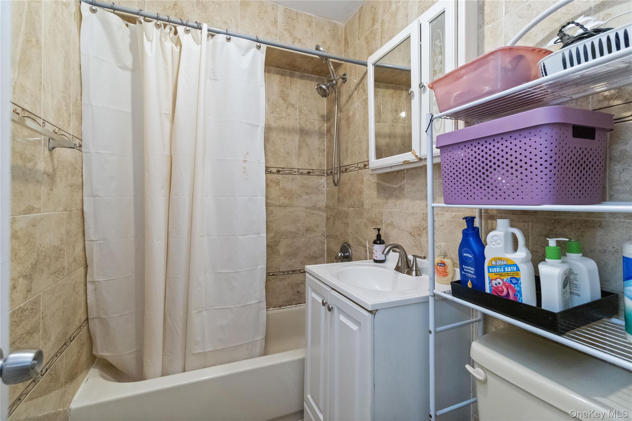 10223 43rd Avenue, Unit 2B Queens, NY 11368 - Photo 14 of 15 a utility room with dryer and washer