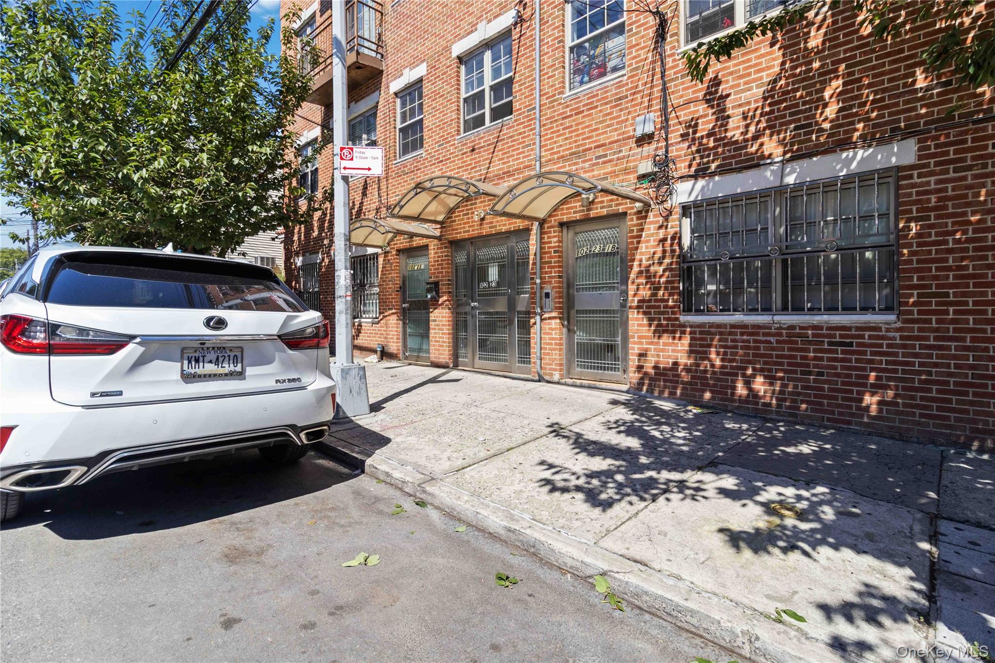 10223 43rd Avenue, Unit 2B Queens, NY 11368 - Photo 2 of 15 a view of a cars park in front of a building