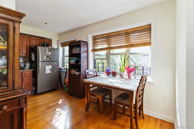 a dining room with furniture and window