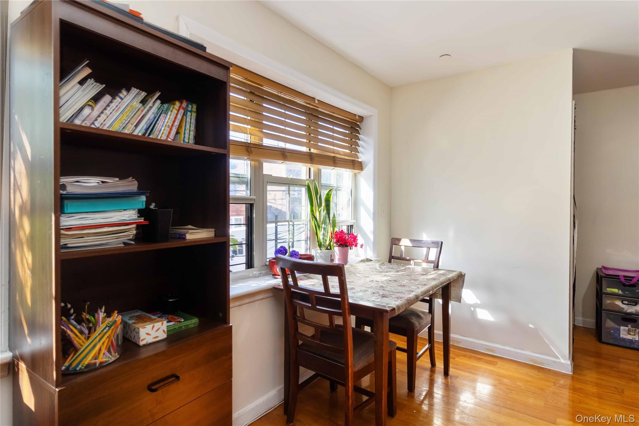 10223 43rd Avenue, Unit 2B Queens, NY 11368 - Photo 8 of 15 a view of a dining room with furniture window and wooden floor