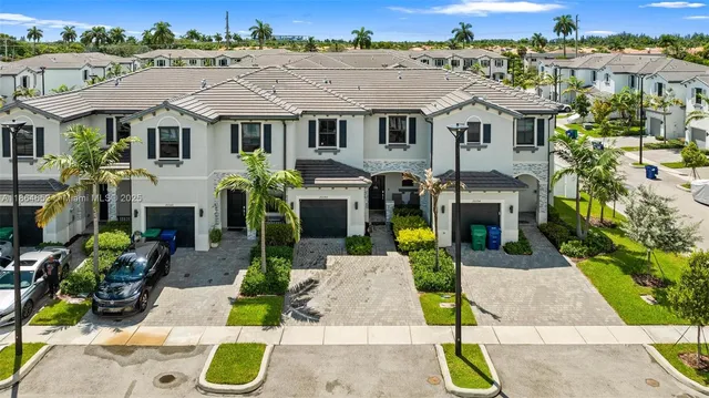 a aerial view of a house with large garden and plants