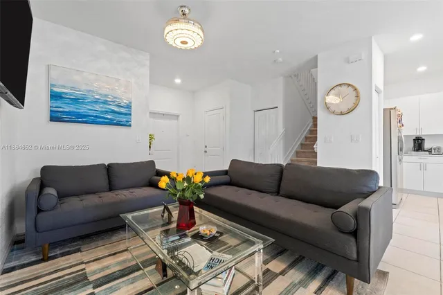a living room with furniture and a rug