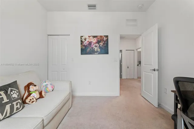 a bedroom with a bed and a table in it