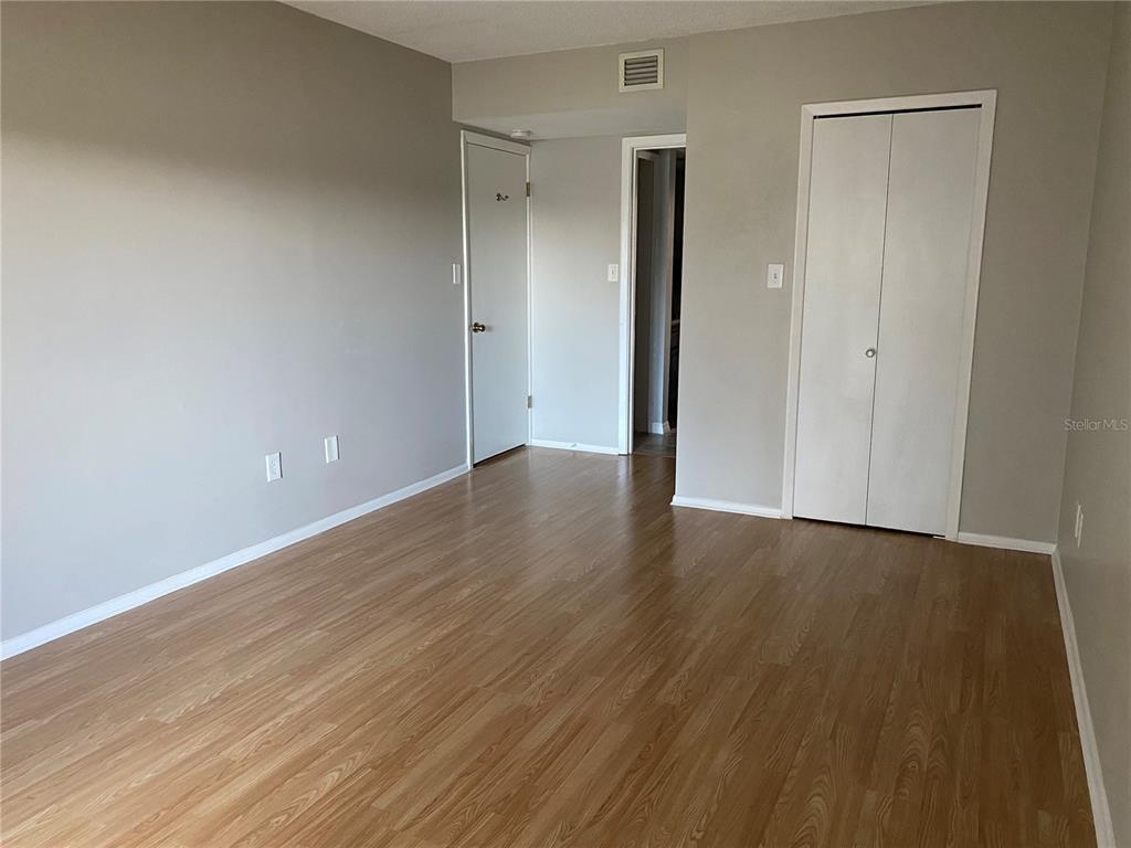 4400 Castlepalm Road Orlando, FL 32839 - Photo 17 of 38 a view of an empty room with wooden floor