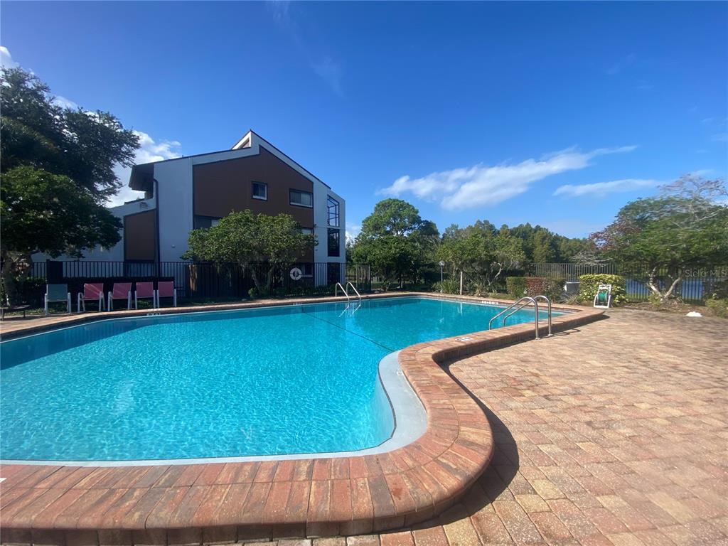 4400 Castlepalm Road Orlando, FL 32839 - Photo 32 of 38 a view of swimming pool with a yard