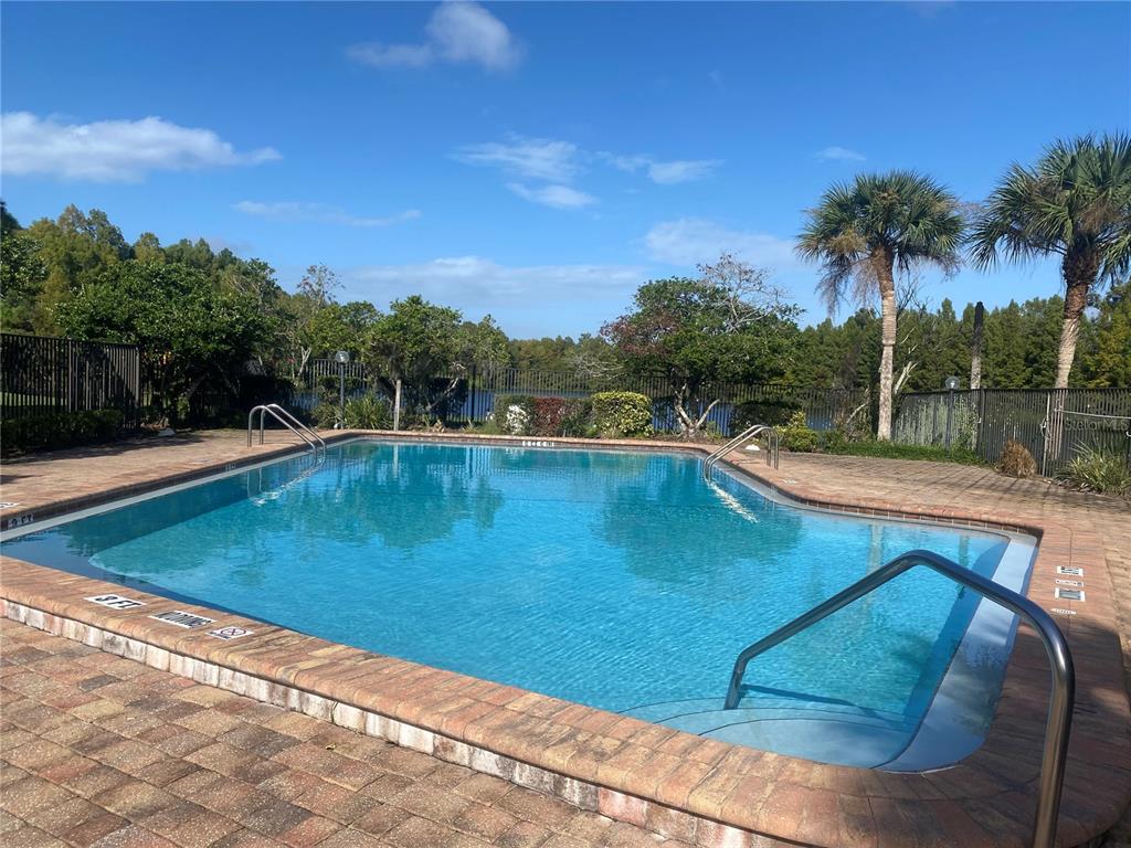 4400 Castlepalm Road Orlando, FL 32839 - Photo 33 of 38 a view of a swimming pool with a patio