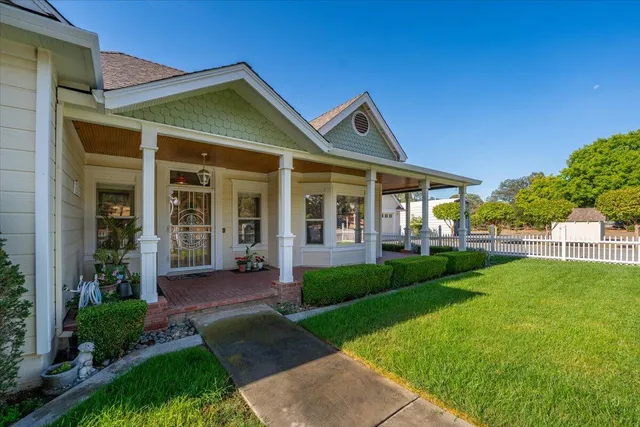a front view of a house with garden