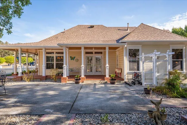 a bathroom with a toilet and a shower curtain