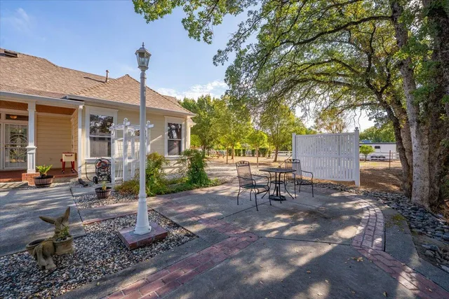 a view of a house with a yard and garage