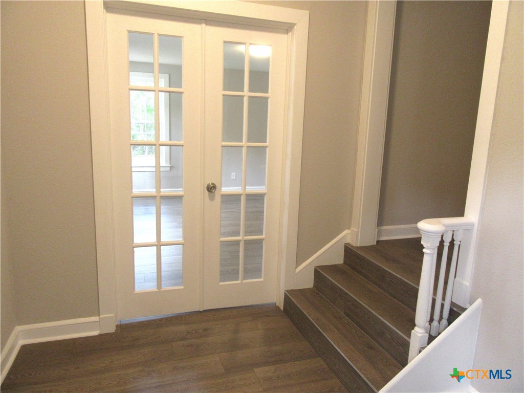 415 Easy Street Marlin, TX 76661 - Photo 32 of 45 a view of wooden floor and windows in a room