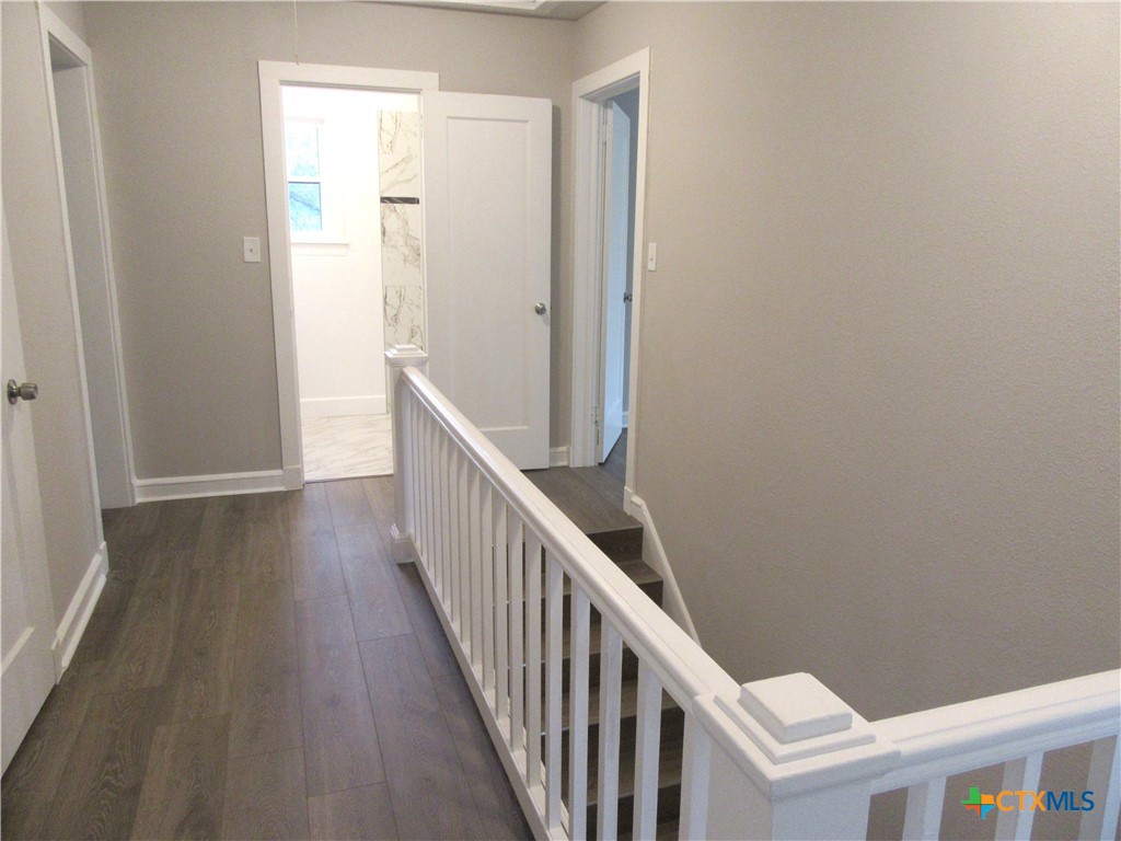 415 Easy Street Marlin, TX 76661 - Photo 33 of 45 a view of a hallway with wooden floor