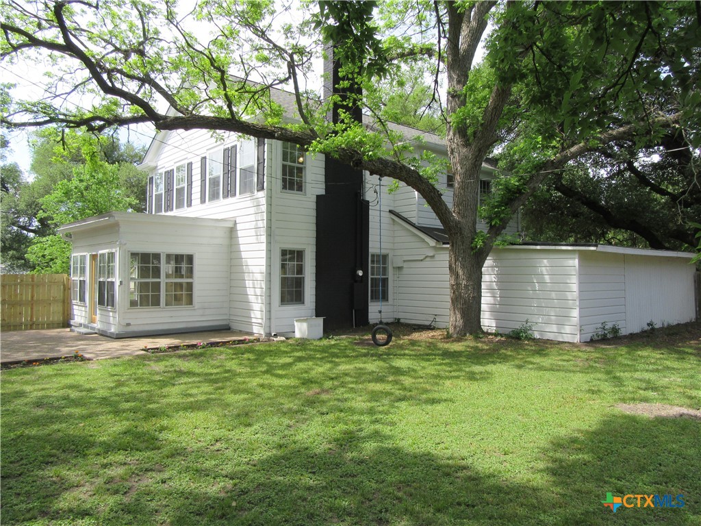 415 Easy Street Marlin, TX 76661 - Photo 41 of 45 a view of a yard in front of a house with plants and large tree