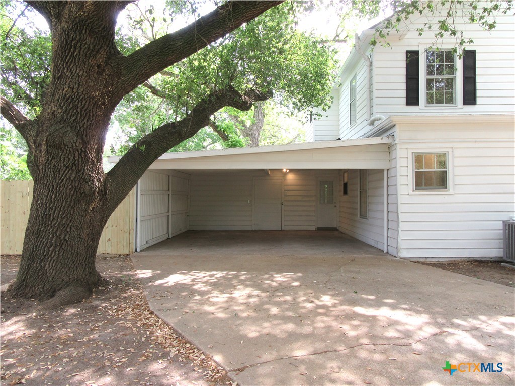 415 Easy Street Marlin, TX 76661 - Photo 5 of 45 a view of backyard with a large tree