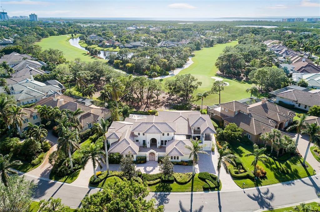 an aerial view of residential house with outdoor space and swimming pool