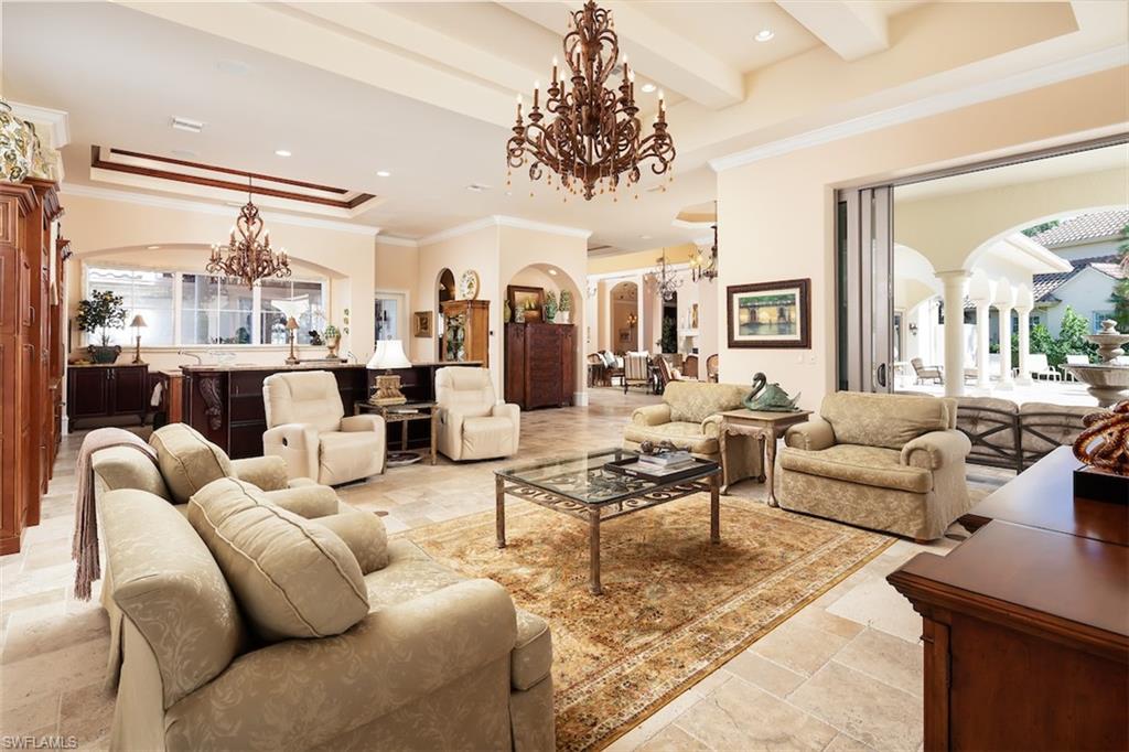 219 Cheshire Way Naples, FL 34110 - Photo 14 of 46 a living room with furniture large window and a table