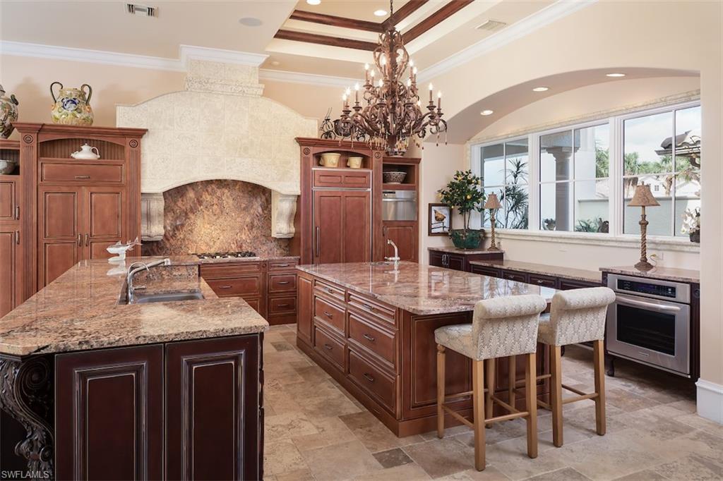 219 Cheshire Way Naples, FL 34110 - Photo 15 of 46 a kitchen with a counter space a sink and appliances