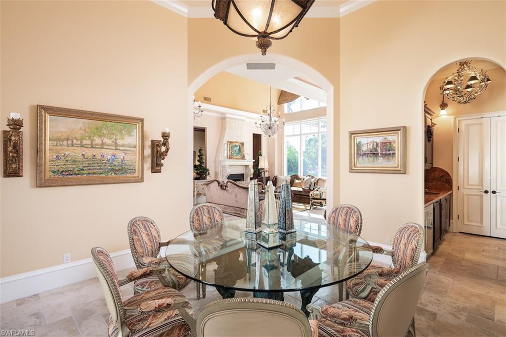 219 Cheshire Way Naples, FL 34110 - Photo 17 of 46 a dining room with furniture and wooden floor